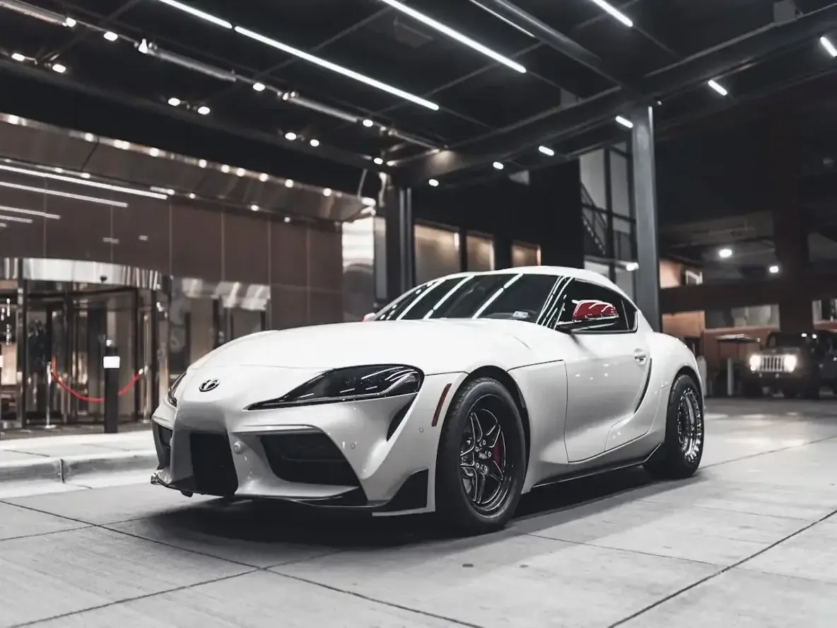 white toyota supra showing off its freshly dark tinted windows